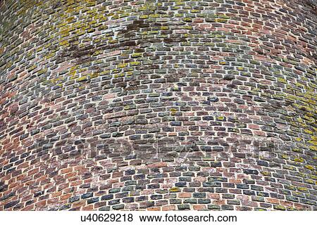 Stock Photo - Close-up view of red cobbled tower. Fotosearch