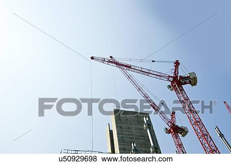 Stock Photo - Crane above construction sites. Fotosearch