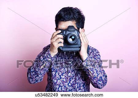 Stock Photo - Creative Asian Photographer . Fotosearch