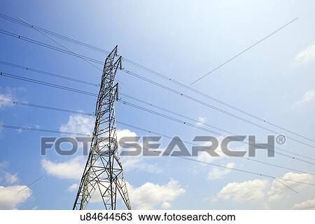 Stock Image - Electricity Pylon against clear sky. Fotosearch