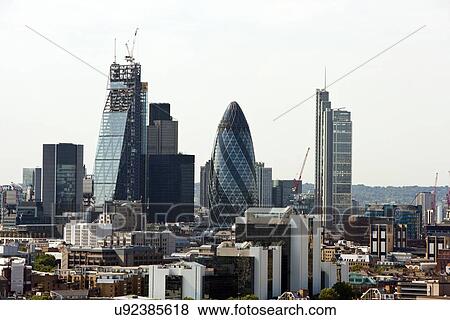 Stock Photo - Elevated view of The Gherkin and surrounding buildings, London. Fotosearch