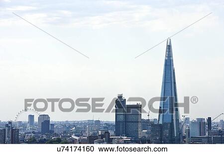 Stock Image - Elevated view of The Shard and London Eye, London. Fotosearch