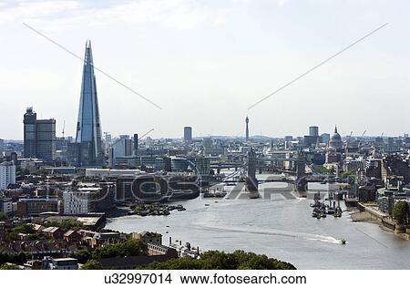 Elevated view of Tower Bridge, The Shard, and St Pauls in London View Large Photo Image Picture - Elevated view of Tower Bridge, The Shard, and St Pauls in London. Fotosearch