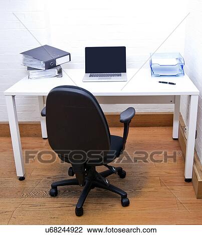 Empty office chair with laptop on desk View Large Photo Image Stock Image - Empty office chair with laptop on desk. Fotosearch