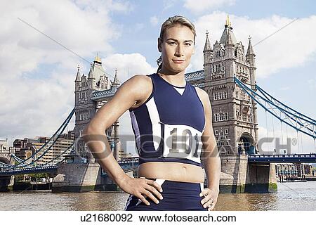Female Athlete standing in front of Tower Bridge View Large Photo Image Stock Image - Female Athlete standing in front of Tower Bridge. Fotosearch