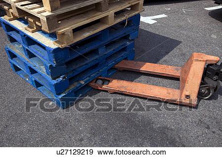 Stock Photo - Forklift and wooden crates outdoors. Fotosearch