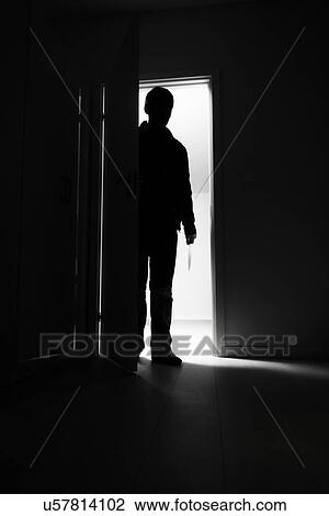 Full-length of burglar entering into house View Large Photo Image Stock Image - Full-length of burglar entering into house. Fotosearch