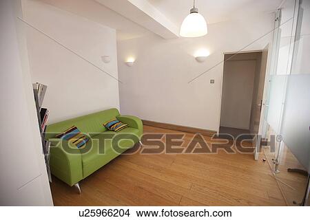 Green sofa in empty office View Large Photo Image Picture - Green sofa in empty office. Fotosearch