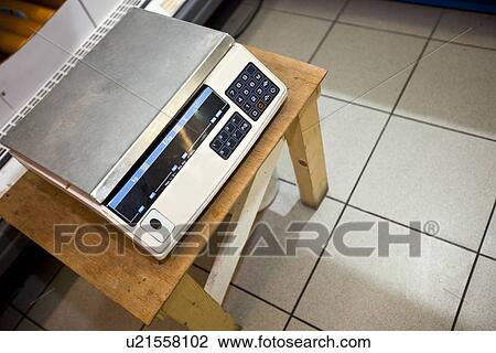 High angle view of weighing machine on stool in supermarket View Large Photo Image Stock Image - High angle view of weighing machine on stool in supermarket. Fotosearch
