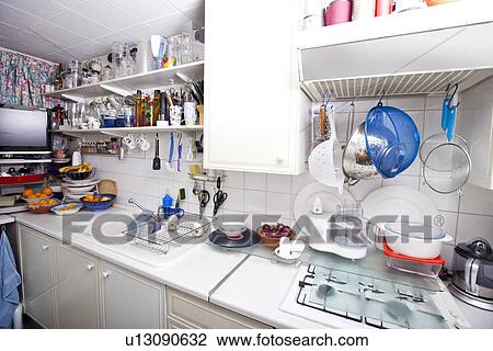 Interior of domestic kitchen with utensils and shelves View Large Photo Image Stock Image - Interior of domestic kitchen with utensils and shelves. Fotosearch