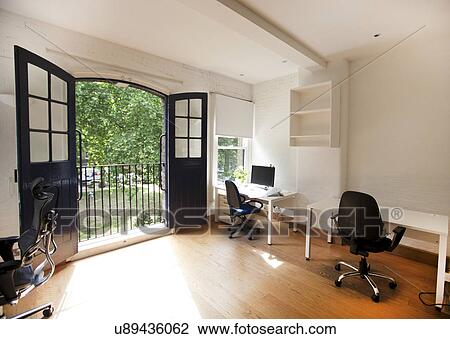 Interior of empty office with desks and chairs View Large Photo Image Stock Image - Interior of empty office with desks and chairs. Fotosearch