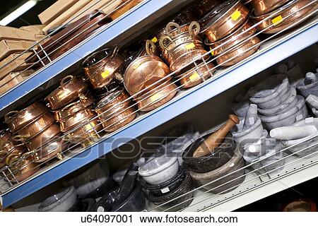 Stock Image - Kitchenwares on display in utensil store. Fotosearch