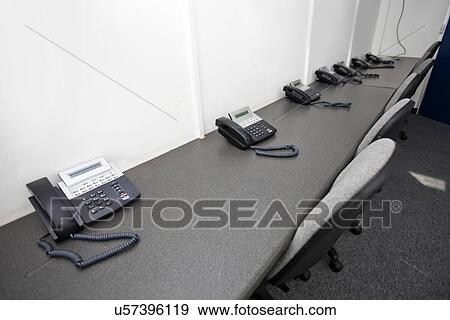 Stock Photo - Landline telephones and chairs in television station. Fotosearch