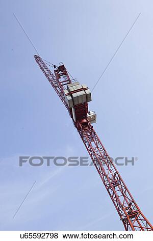 Low angle view of construction crane against sky View Large Photo Image Stock Photo - Low angle view of construction crane against sky. Fotosearch