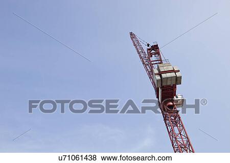 Low angle view of crane against sky View Large Photo Image Stock Photo - Low angle view of crane against sky. Fotosearch