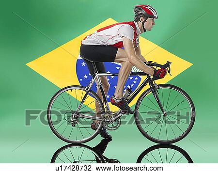 Male Cyclist cycling in front of Brazilian Flag View Large Photo Image Stock Image - Male Cyclist cycling in front of Brazilian Flag. Fotosearch