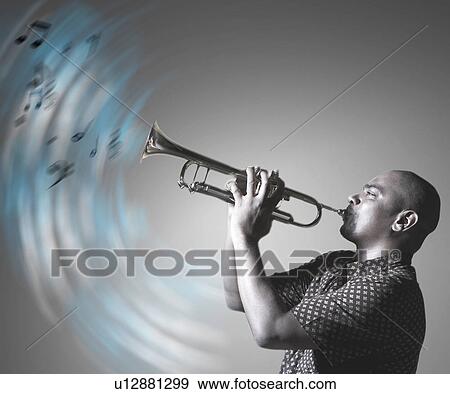 Stock Photo - Man playing trumpet and making music. Fotosearch