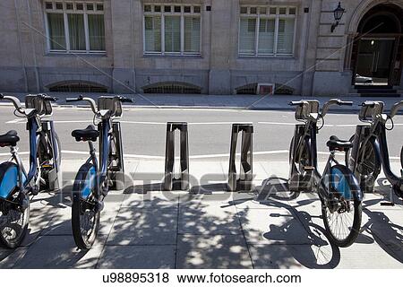 Stock Photo - Public Rental Bicycles in a Line, London, UK. Fotosearch