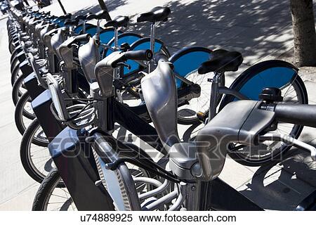 Public Rental Bicycles in a Line, London, UK View Large Photo Image Stock Photography - Public Rental Bicycles in a Line, London, UK. Fotosearch