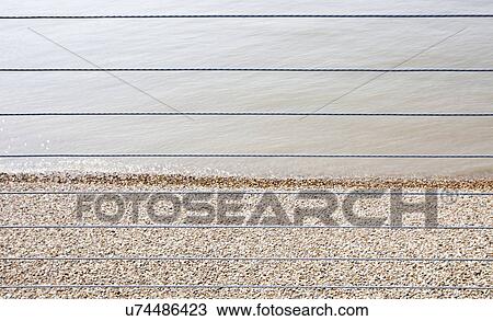 River Thames and Shingle beach behind wire rope fence View Large Photo Image Stock Image - River Thames and Shingle beach behind wire rope fence. Fotosearch
