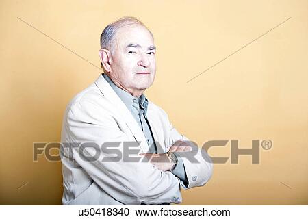 Senior adult man folding his arms View Large Photo Image Stock Image - Senior adult man folding his arms. Fotosearch