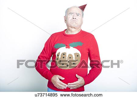 Stock Photography - Senior Adult Man indicating that he is full up. Fotosearch