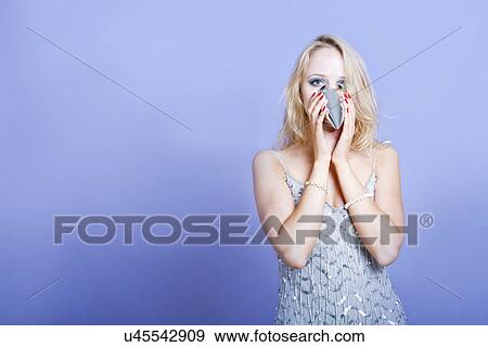 Sexy blonde party girl wearing silver dress and party hat View Large Photo Image Stock Photo - Sexy blonde party girl wearing silver dress and party hat. Fotosearch