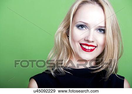 Sexy blonde woman on green background View Large Photo Image Stock Photo - Sexy blonde woman on green background. Fotosearch
