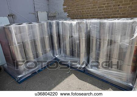 Stack of tins outside warehouse View Large Photo Image Stock Image - Stack of tins outside warehouse. Fotosearch
