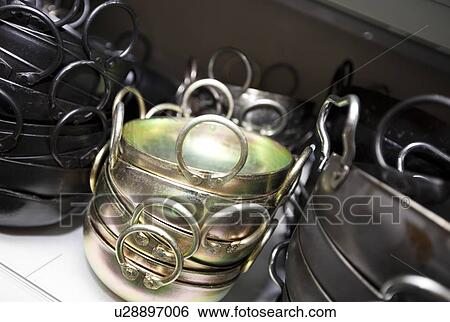 Stacked kitchen utensils in store View Large Photo Image Stock Photograph - Stacked kitchen utensils in store. Fotosearch