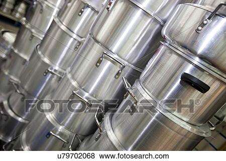 Stacked kitchen utensils in supermarket View Large Photo Image Stock Photo - Stacked kitchen utensils in supermarket. Fotosearch