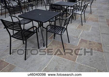 Tables and chairs at outdoor cafe View Large Photo Image Stock Photo - Tables and chairs at outdoor cafe. Fotosearch