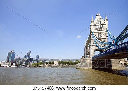 Tower Bridge in London with City of London in the background View Large Photo Image Stock Photograph - Tower Bridge in London with City of London in the background. Fotosearch