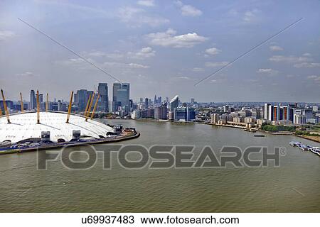 Stock Image - UK, England, London, 02 Arena and Canary Wharf Skyline. Fotosearch