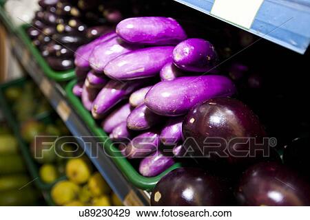 Variety of eggplants on display in grocery store View Large Photo Image Stock Photo - Variety of eggplants on display in grocery store. Fotosearch