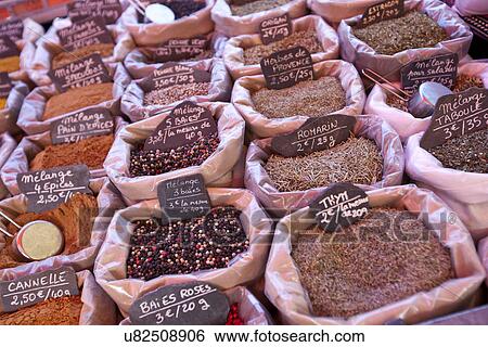 Stock Photograph - Variety of spices on display in store. Fotosearch