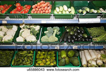 Variety of vegetables on display in supermarket View Large Photo Image Stock Image - Variety of vegetables on display in supermarket. Fotosearch