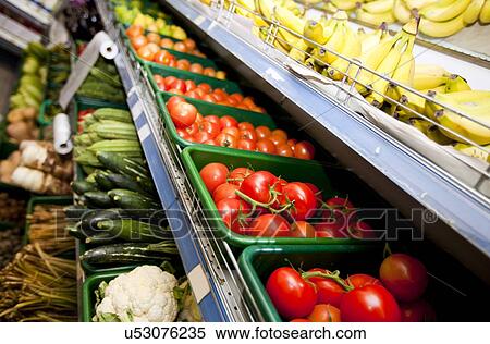 Various vegetables and fruits on display in supermarket View Large Photo Image Stock Photography - Various vegetables and fruits on display in supermarket. Fotosearch