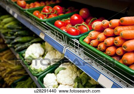 Various vegetables on display in grocery store View Large Photo Image Stock Image - Various vegetables on display in grocery store. Fotosearch
