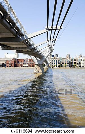 Picture - View from below of Millennium Bridge . Fotosearch