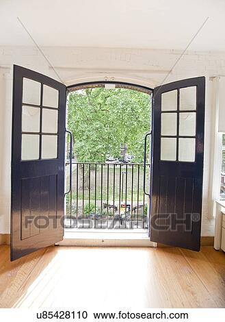 Stock Image - View of garden through open office door. Fotosearch