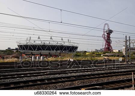 View of railway tracks and building against sky View Large Photo Image Picture - View of railway tracks and building against sky. Fotosearch