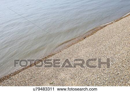 View of the Sea and shingle beach View Large Photo Image Stock Image - View of the Sea and shingle beach. Fotosearch