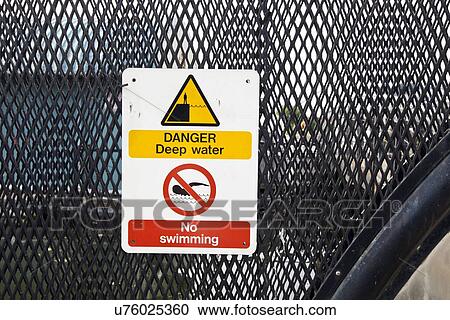 Stock Image - Warning sign no swimming. Fotosearch