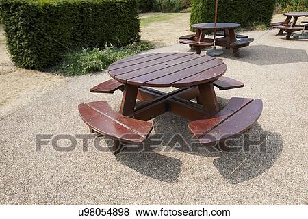 Wooden picnic tables in park View Large Photo Image Stock Photo - Wooden picnic tables in park. Fotosearch