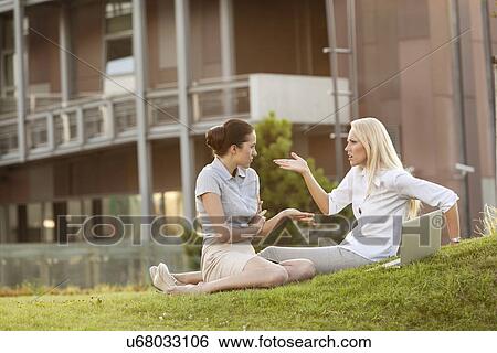 Young businesswomen arguing in office lawn View Large Photo Image Stock Photograph - Young businesswomen arguing in office lawn. Fotosearch