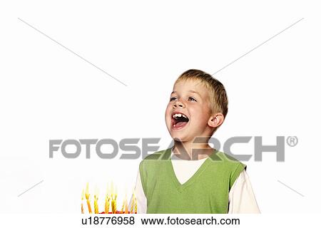 Young Child blowing out his birthday candles View Large Photo Image Stock Photo - Young Child blowing out his birthday candles. Fotosearch