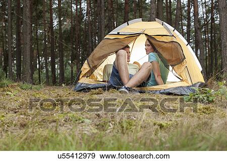 Young couple camping in forest View Large Photo Image Stock Photo - Young couple camping in forest. Fotosearch