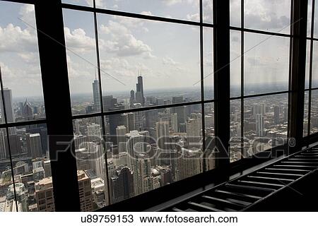 Aerial City viewed through the window of a building, Chicago, Cook County, Illinois, USA View Large Photo Image Stock Image - Aerial City viewed through the window of a building, Chicago, Cook County, Illinois, USA. Fotosearch