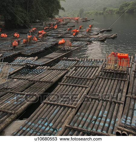 Stock Image - Bamboo rafts in the Yulong River, Yangshuo, Guilin, Guangxi Province, China. Fotosearch